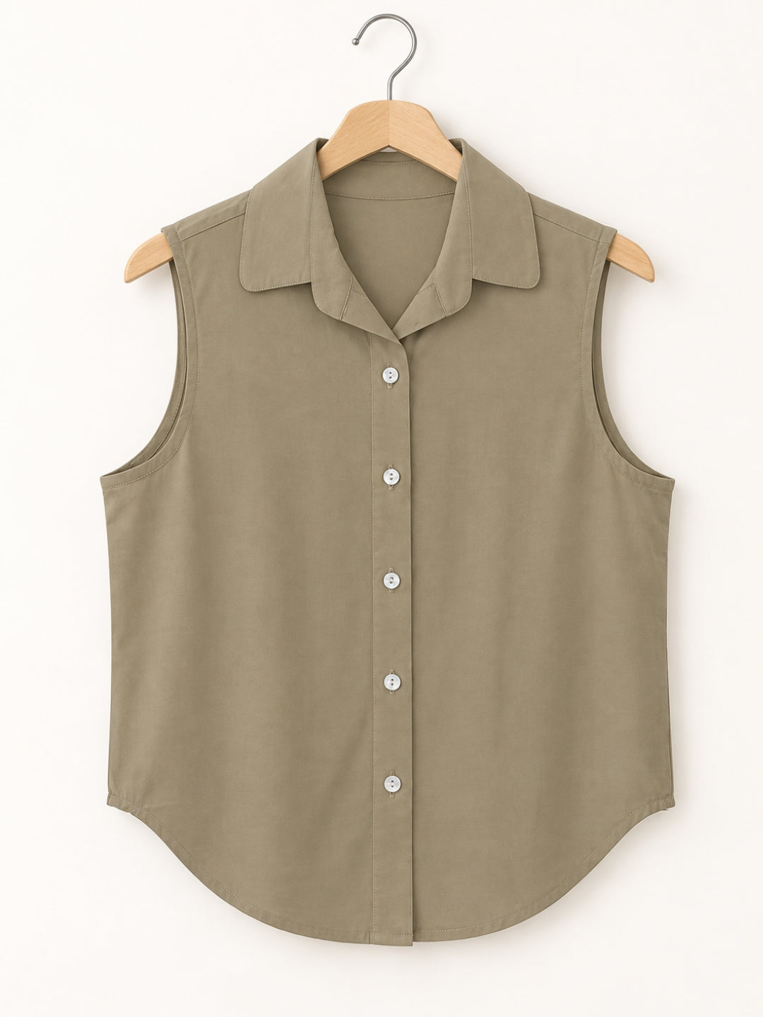 Beige cotton sleeveless cropped shirt with round collar, front button placket and curved hem – Jolene
