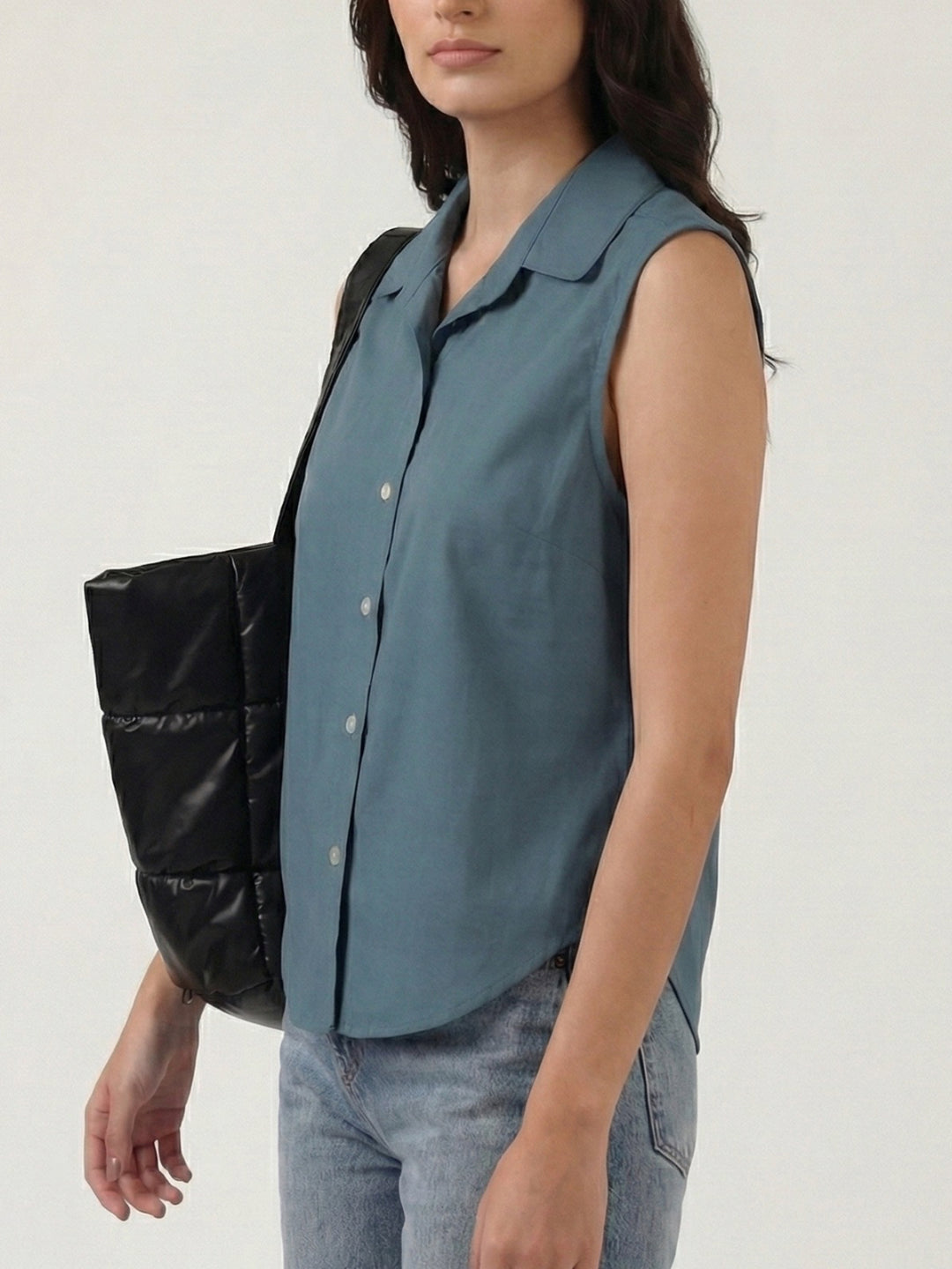 Blue grey cotton sleeveless cropped shirt with round collar, front button placket and curved hem – Jolene