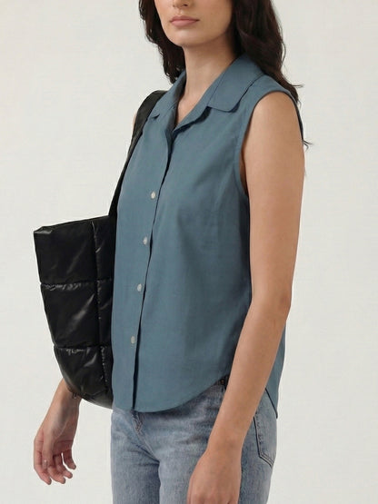 Blue grey cotton sleeveless cropped shirt with round collar, front button placket and curved hem – Jolene