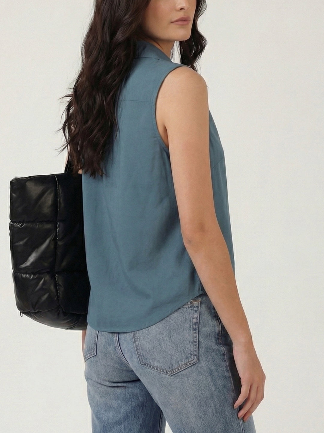 Blue grey cotton sleeveless cropped shirt with round collar, front button placket and curved hem – Jolene