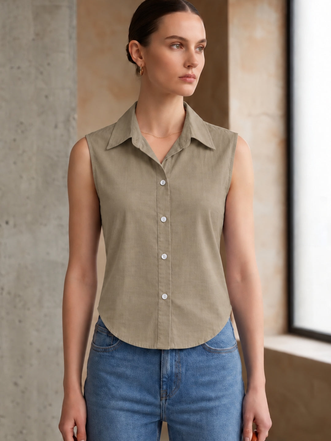 Beige cotton sleeveless cropped shirt with round collar, front button placket and curved hem – Jolene