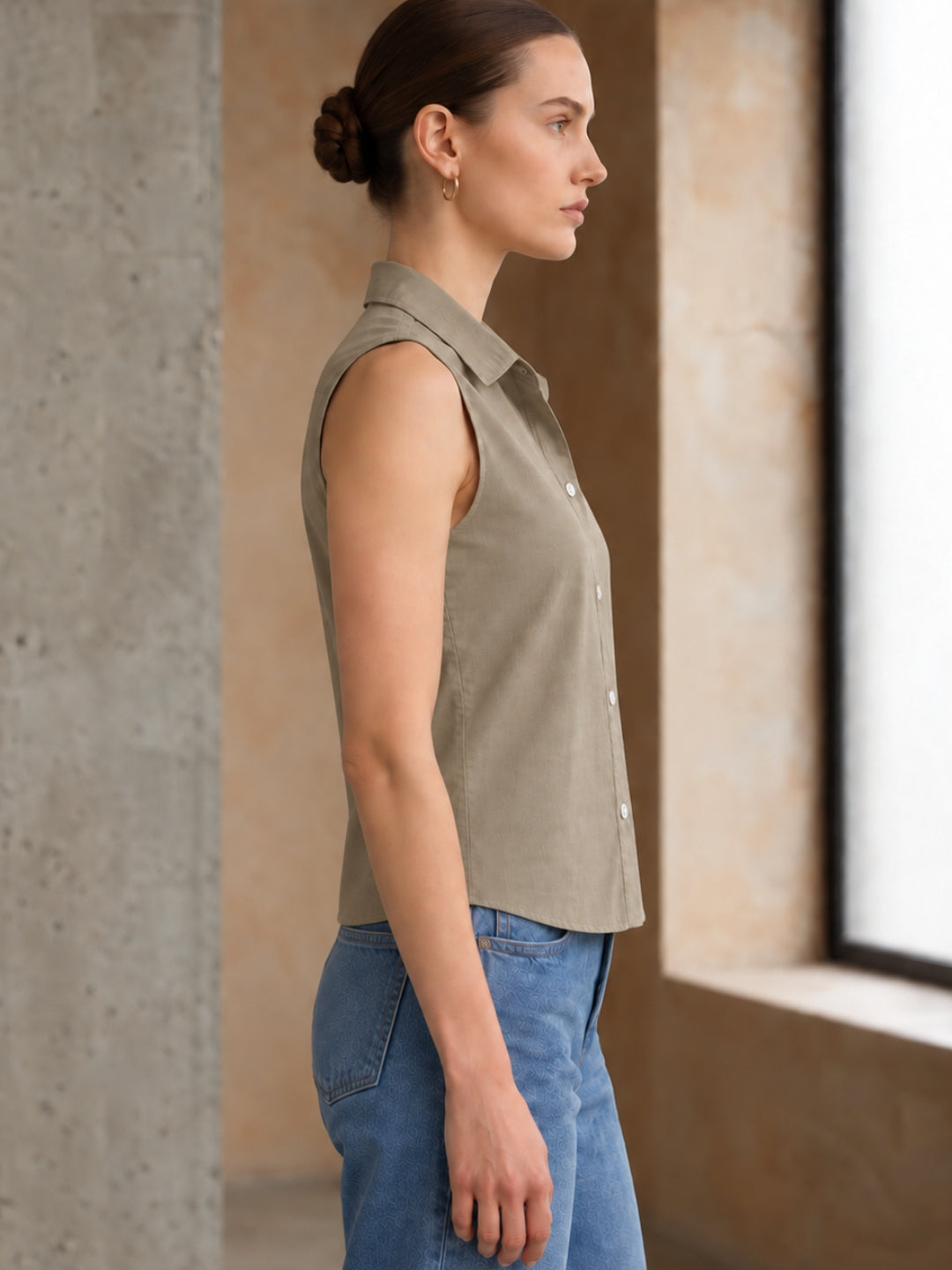 Beige cotton sleeveless cropped shirt with round collar, front button placket and curved hem – Jolene
