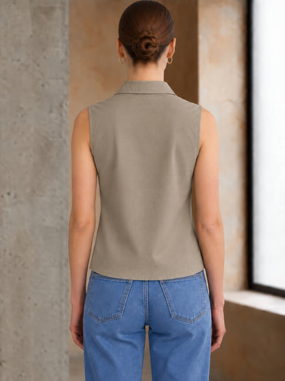 Beige cotton sleeveless cropped shirt with round collar, front button placket and curved hem – Jolene