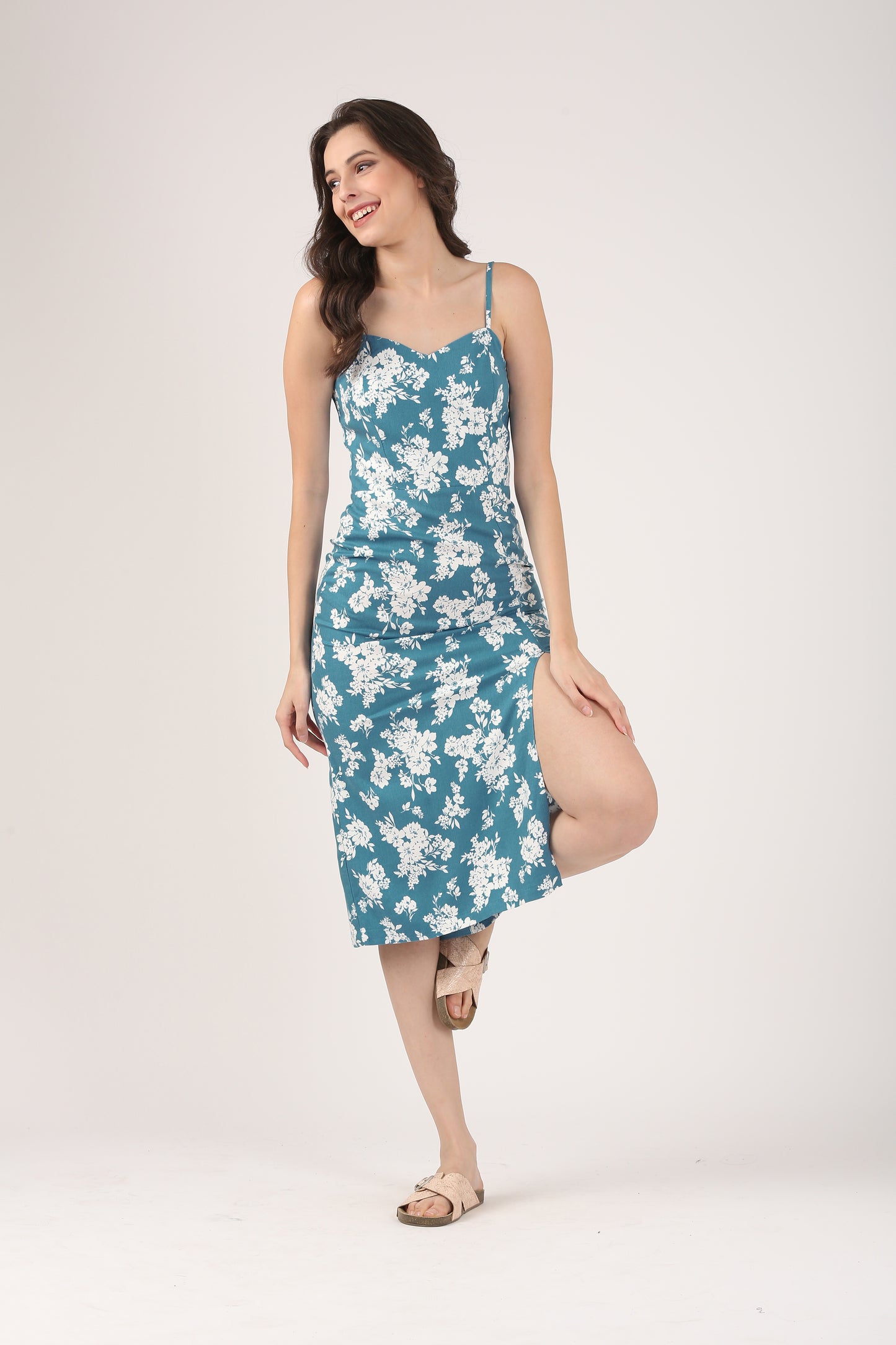 Spaghetti strap cotton midi dress in teal floral, perfect for dinner dates or holiday wear, sustainably crafted